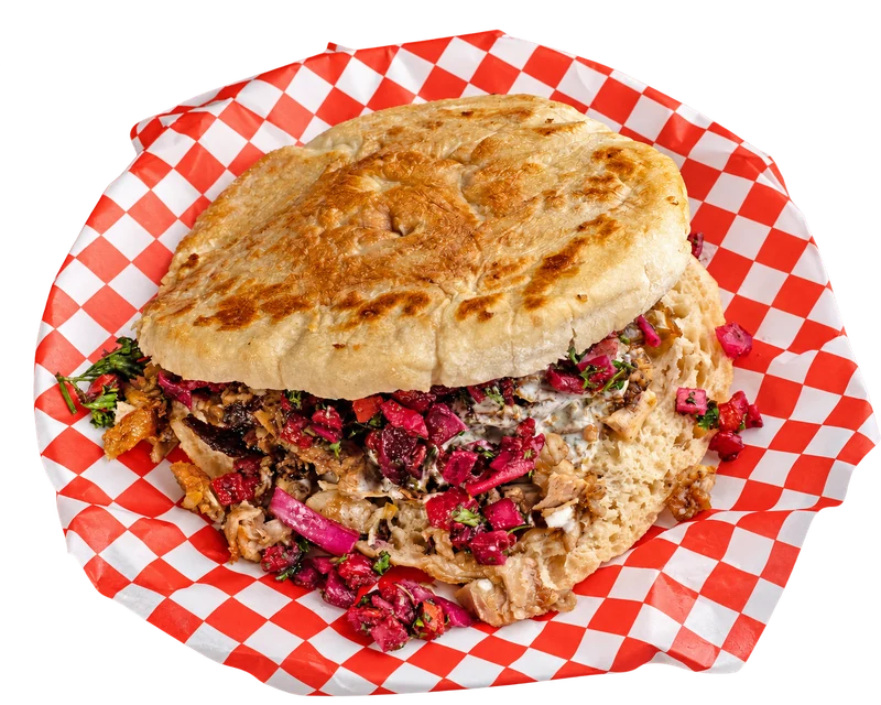Chicken doner in golden lepinja on checkered paper