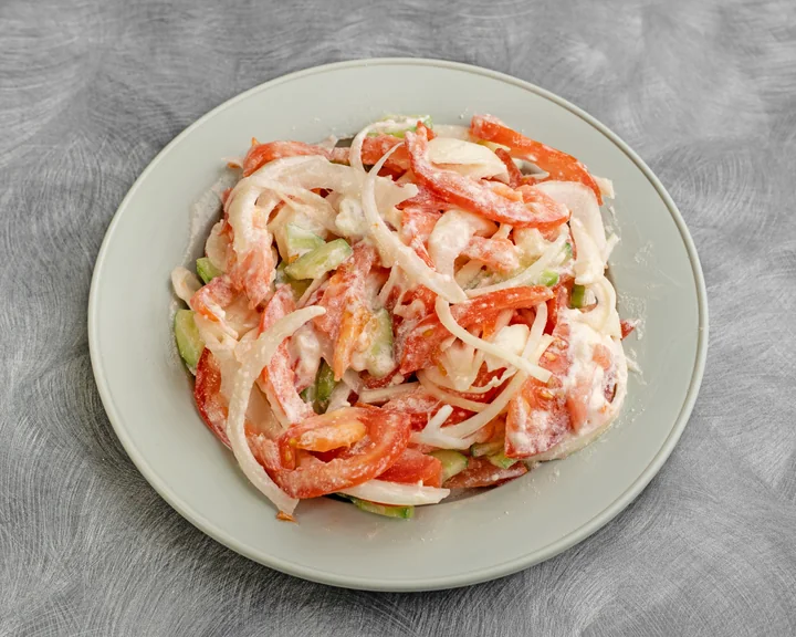 House salad of vegetables in a creamy dressing